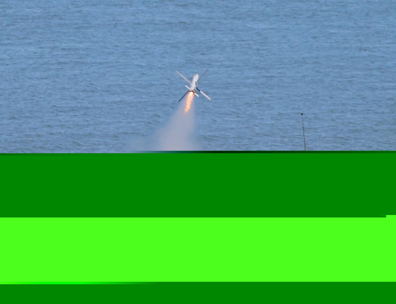 A South Korean Marine Corps tank fires a missile into the waters off Yeonpyeong Island, south of the maritime border with North Korea, in the first such drills held in six years and 10 months, Wednesday. (Yonhap)