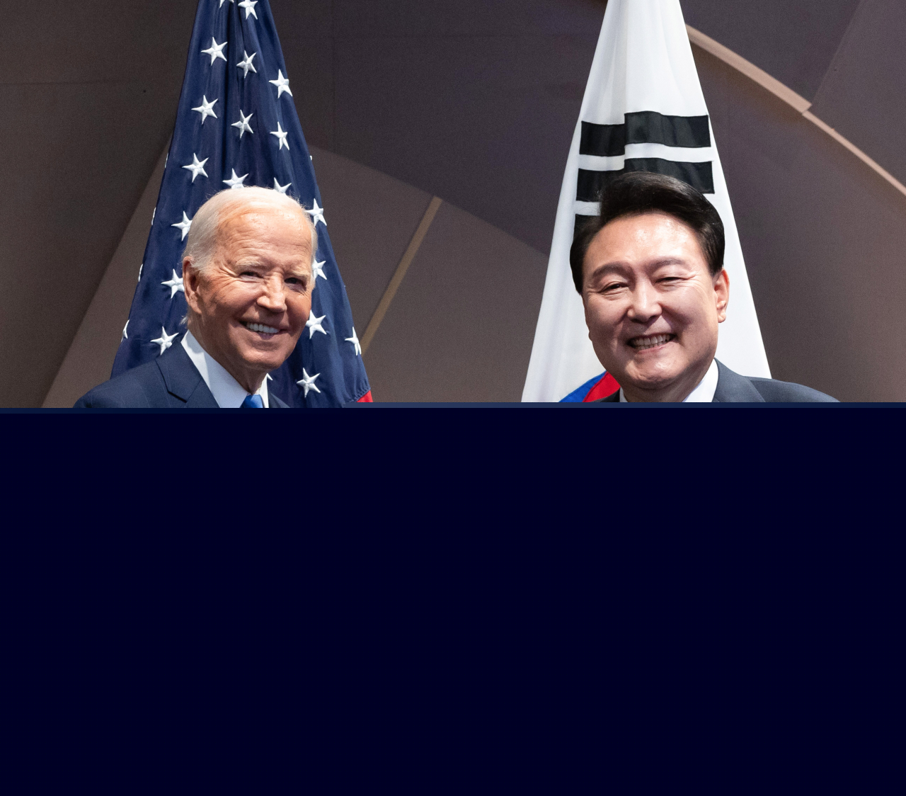 South Korean President Yoon Suk Yeol (right) and US President Joe Biden shake hands during their meeting held on the sidelines of the North Atlantic Treaty Organization (NATO) summit held in Washington D.C. on Thursday. (Pool photo via Yonhap)
