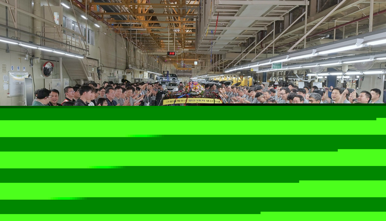 Renault Korea officials celebrate the rollout of the first unit of the new Grand Koleos at its Busan plant on Monday. (Renault Korea)