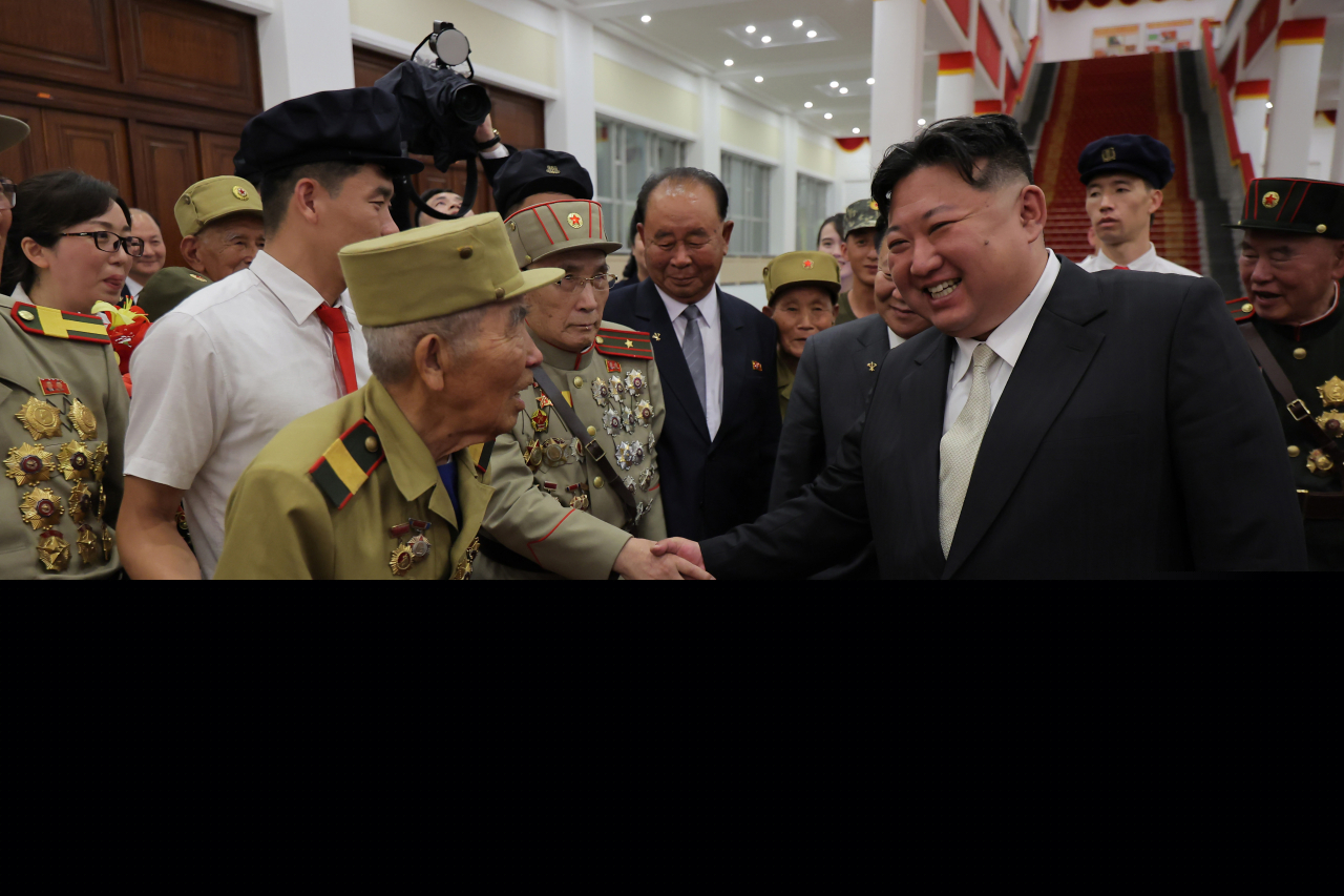 North Korean leader Kim Jong-un (center) meets with war veterans in an event, marking the 71st anniversary of the signing of the armistice that ended the 1950-53 Korean War, in Pyongyang on Saturday, in this photo released by the Korean Central News Agency the following day. (KCNA)