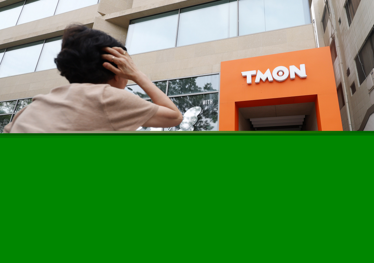A person stands in front of Tmon headquarters in southern Seoul on Sunday, amid delayed payments of Tmon and WeMakePrice under Singapore-based e-commerce company Qoo10. (Newsis)