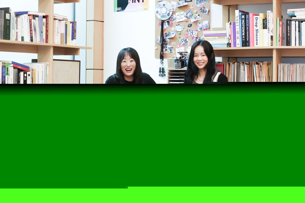 Kang So-yeon (left) and Kim Hee-won, project managers of the Uplus content innovation team, pose for a photo during an interview with The Korea Herald at the Tiny Desk Korea studio in Uplus headquarters in Yongsan-gu, Seoul, Thursday. (LG Uplus)