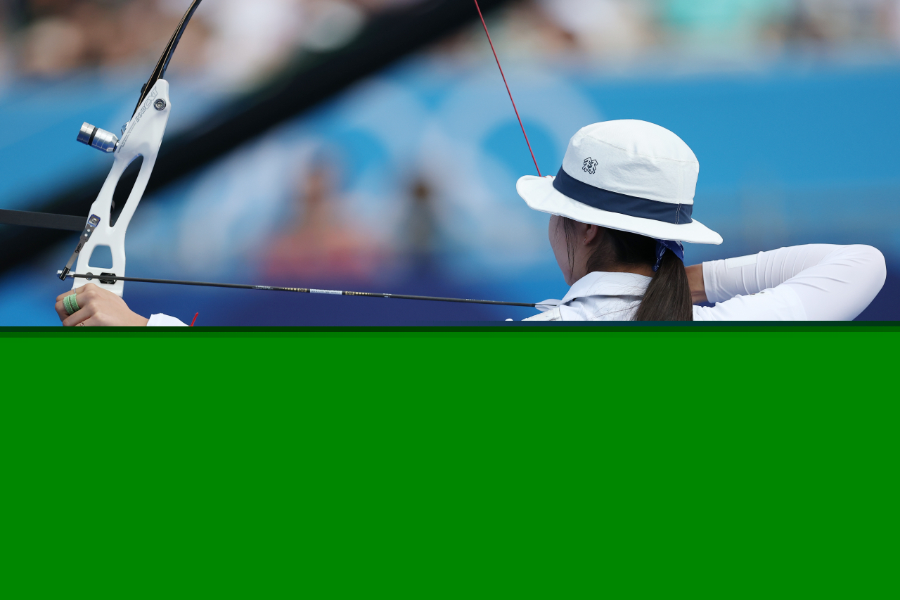 Nam Su-hyeon of the South Korean women's archery team, which achieved a 10th consecutive Olympic victory on Sunday, releases her arrow during the women's team archery final at the Les Invalides archery range in Paris, France, Sunday. (Yonhap)