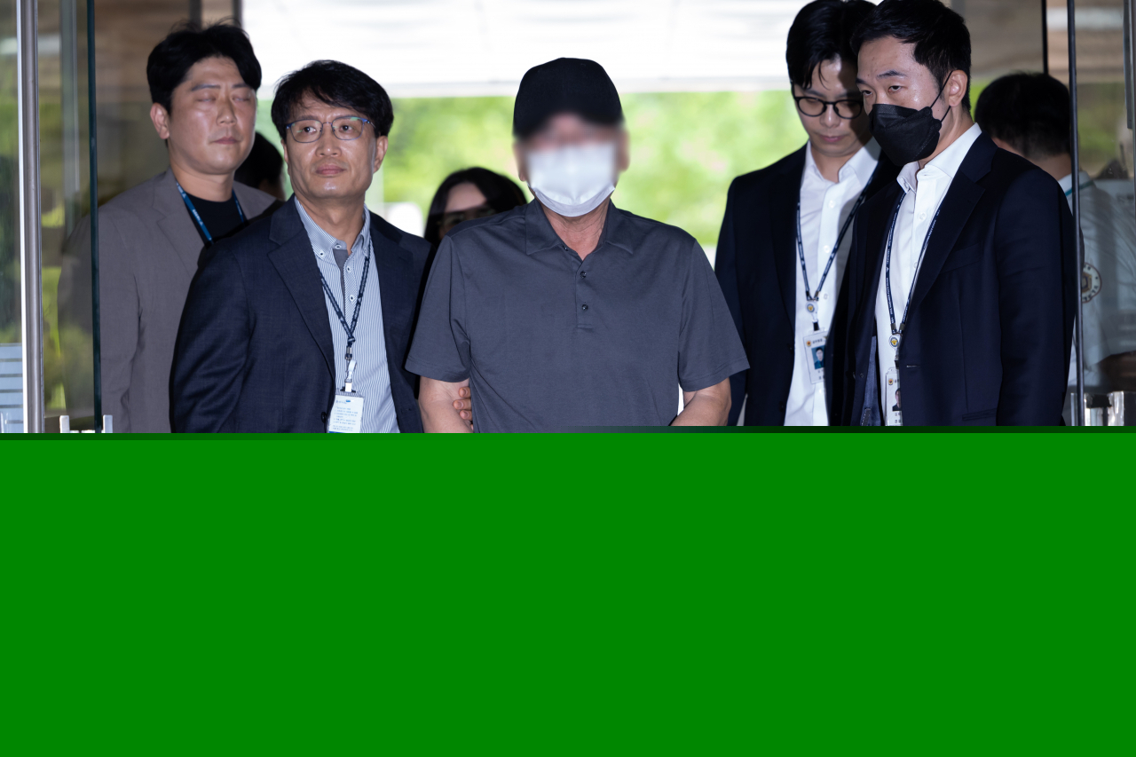 A driver of a car that barreled into pedestrians and killed nine in central Seoul earlier this month attends an arrest warrant hearing on Tuesday. (Yonhap)